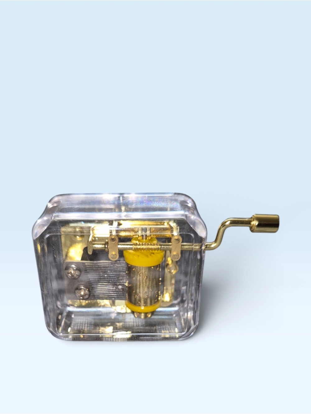Transparent Hand-Crank Music Box with Gold Handle and Yellow Mechanism